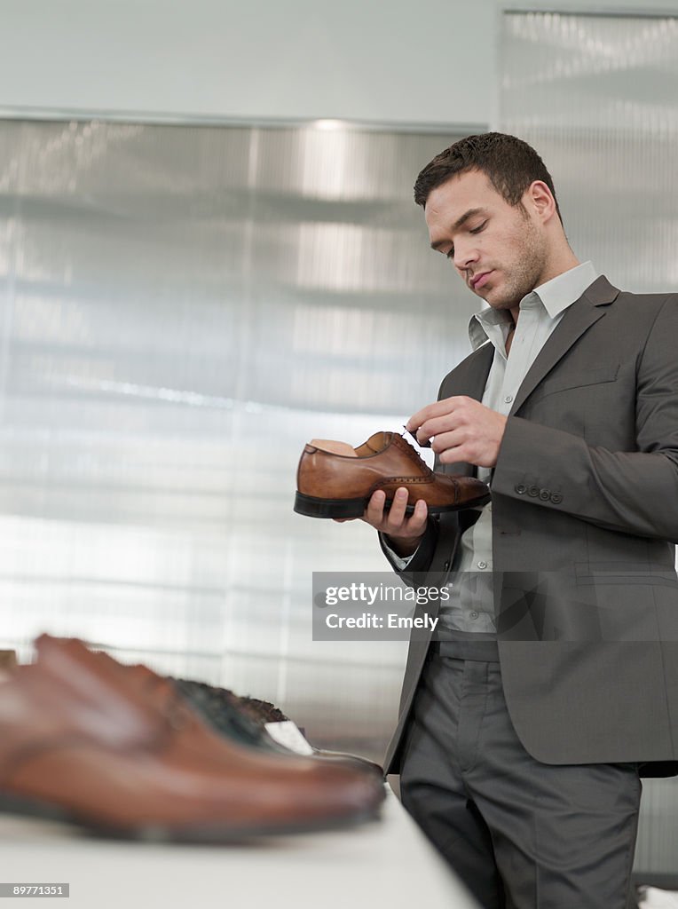 Man shopping looking at shoe