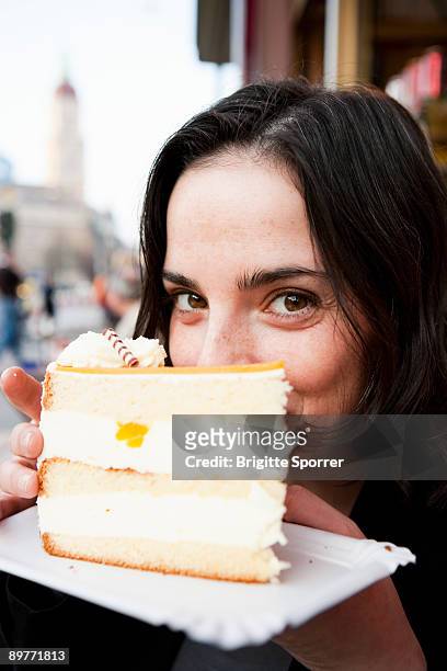woman eating tart - indulgence stockfoto's en -beelden