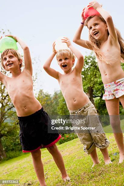 kids playing in garden - penzberg stock-fotos und bilder