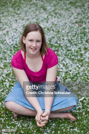 Young Girl Sitting In Garden High-Res Stock Photo - Getty Images