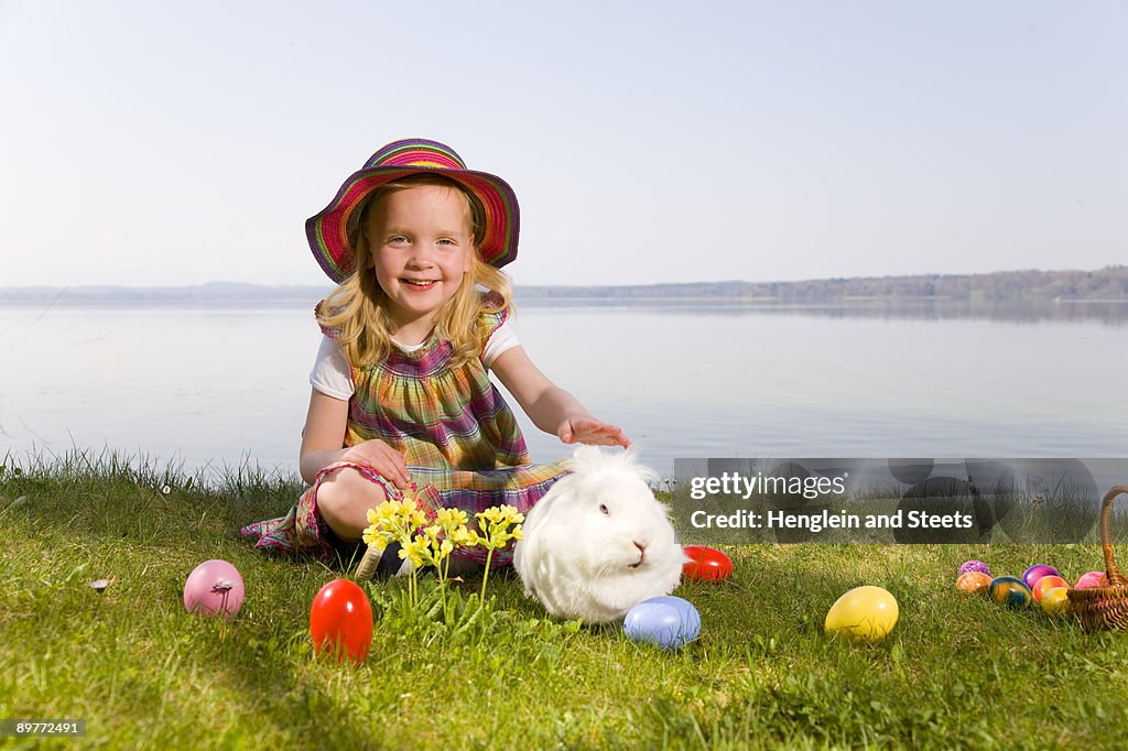 Girl with bunny and easter eggs