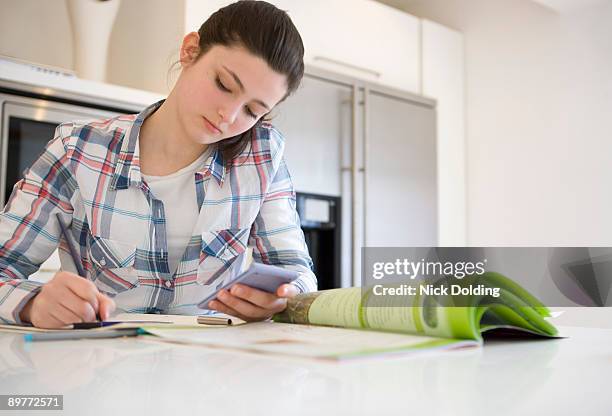 girl 14, studying at home - homework table stock pictures, royalty-free photos & images