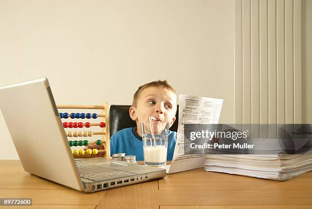 boy with bills - abacus computer stock pictures, royalty-free photos & images