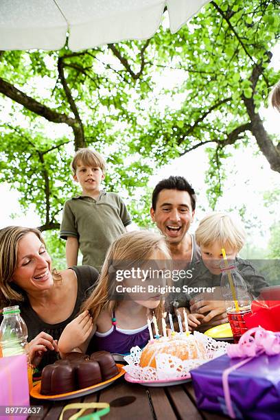 family celebrating birthday - penzberg stock-fotos und bilder