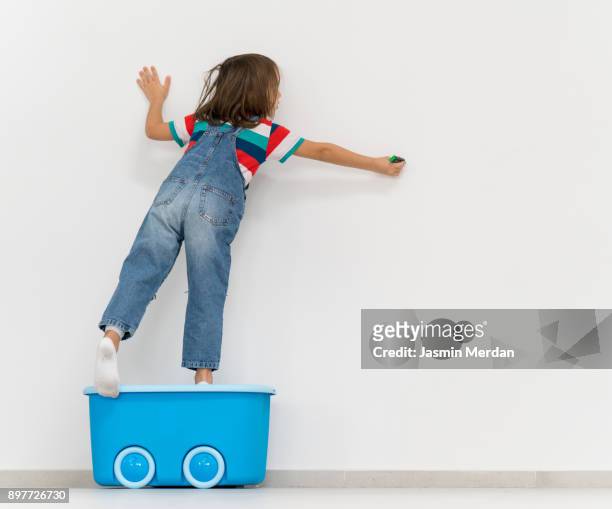 child on empty wall copy space - children room wall stock pictures, royalty-free photos & images