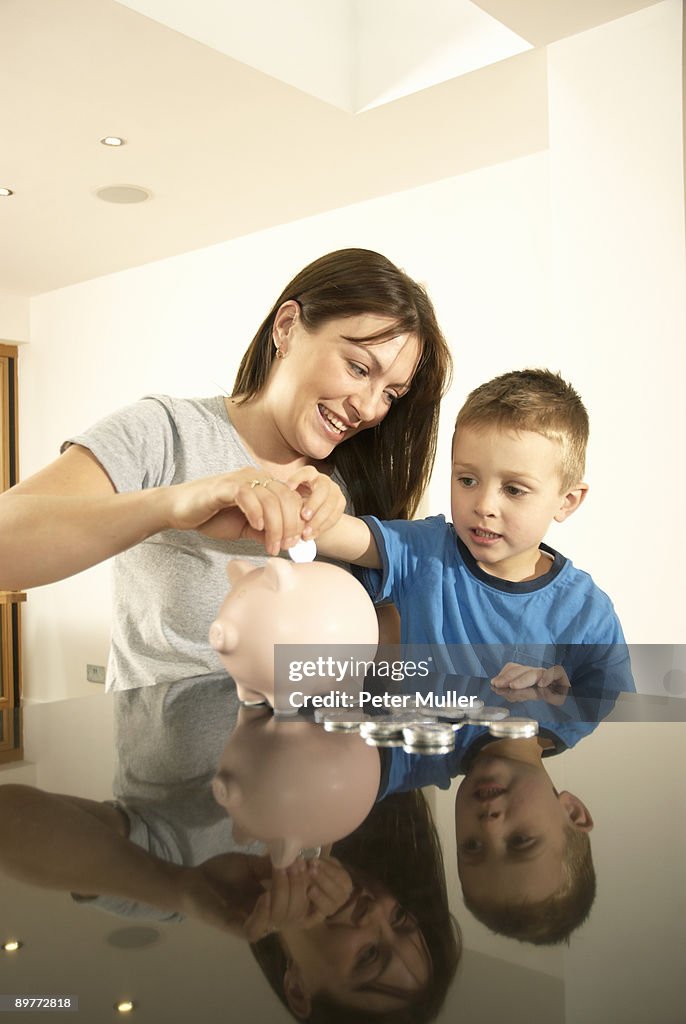 Mum and son with money