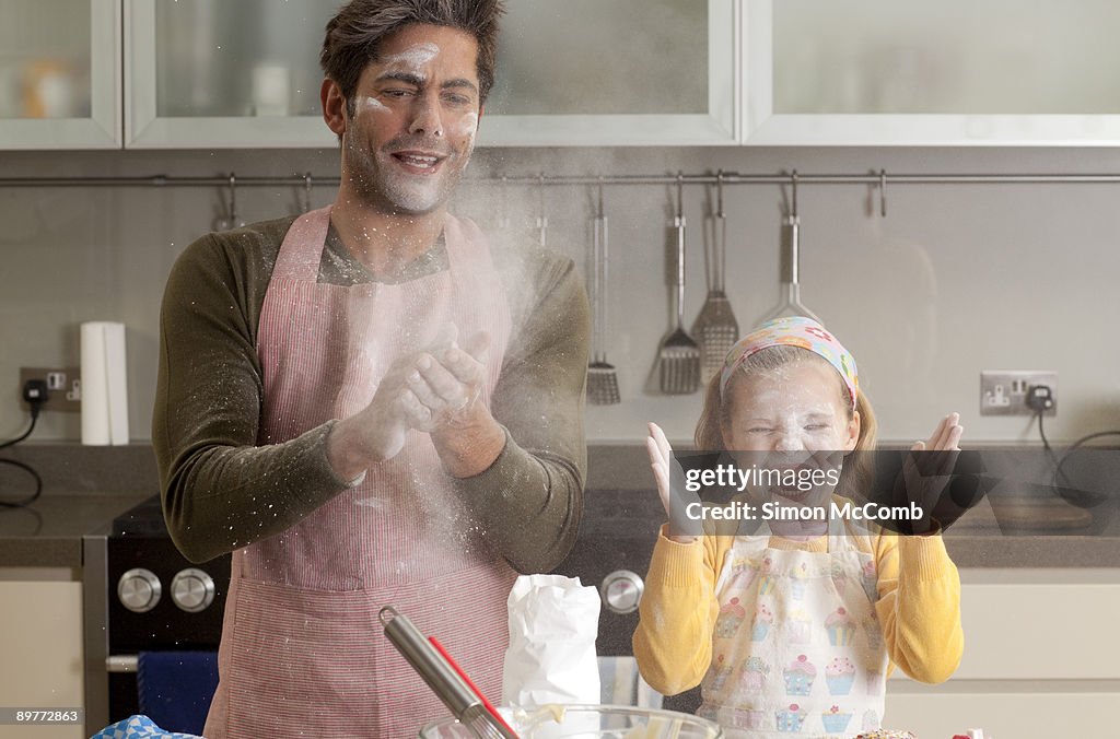 Father and daughter cooking