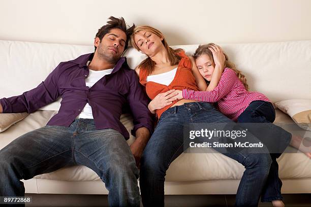 tired family asleep - tired couple stock pictures, royalty-free photos & images
