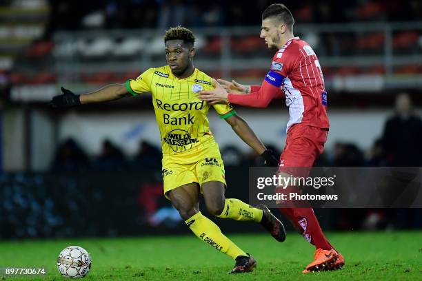 Aaron Leya Iseka forward of SV Zulte Waregem is challenged by Dimitri Mohamed midfielder of Royal Excel Mouscron during the Jupiler Pro League match...