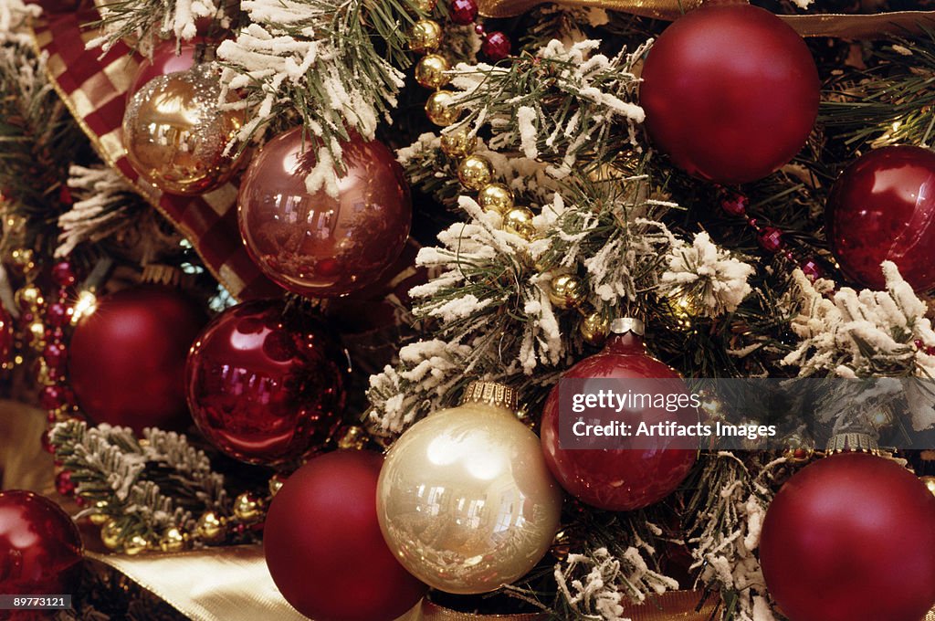 Christmas ornaments on a snowy tree