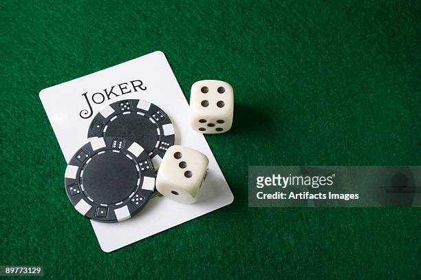 joker card and gambling chips and dice - wild card stock pictures, royalty-free photos & images