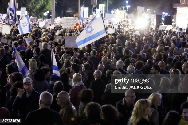 Israelis take part in a demonstration titled the "March of Shame", as they protest against Prime Minister Benjamin Netanyahu and government...