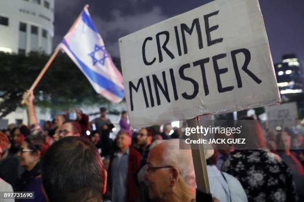 Israelis take part in a demonstration titled the "March of Shame", as they protest against Prime Minister Benjamin Netanyahu and government...