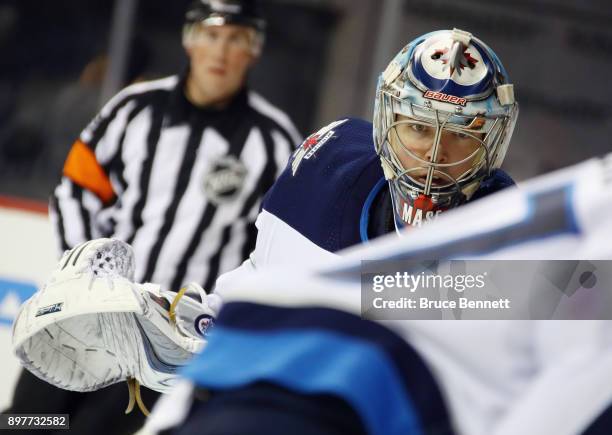 Steve Mason of the Winnipeg Jets tends net against the New York Islanders during the second period at the Barclays Center on December 23, 2017 in the...