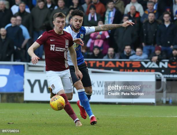Chris Long of Northampton Town controls the ball watched by Derrick Williams of Blackburn Rovers during the Sky Bet League One match between...