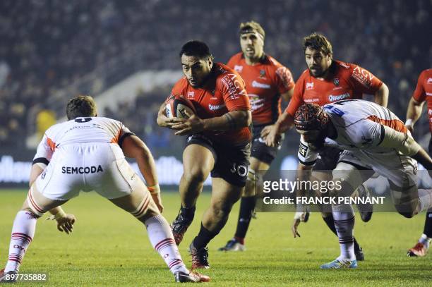 Toulon's French prop Emerick Setiano runs with the ball during the French Top 14 rugby union match between Toulon and Oyonnax on December 23 at the...
