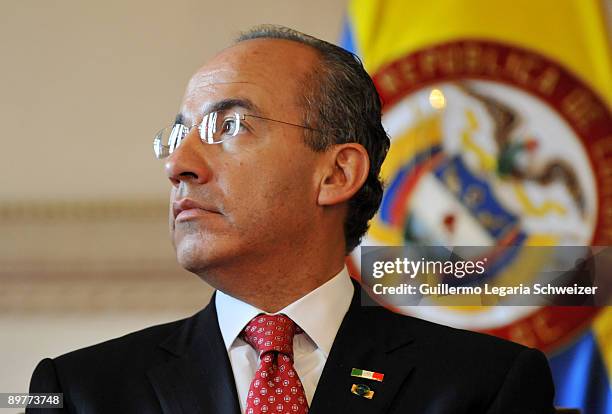 Mexico's President Felipe Calderon looks on after being awarded a 'Key to The City of Bogota' by Mayor Samuel Moreno in a ceremony held at the...