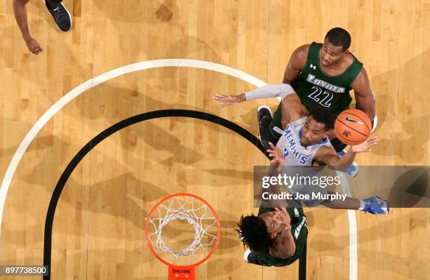 Jeremiah Martin of the Memphis Tigers drives to the basket for a layup against Kavaughn Scott of the Loyola-Maryland Greyhounds on December 23, 2017...