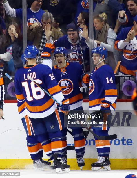 Mathew Barzal of the New York Islanders celebrates his hattrick goal at 11:22 of the third period against the Winnipeg Jets at the Barclays Center on...