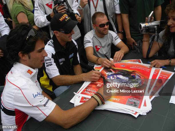 Toni Elias of Spain and San Carlo Honda Gresini , Colin Edwards of USA and Monster Yamaha Tech 3 and Gabor Talmacsi of Hungary and Scot Racing Team...