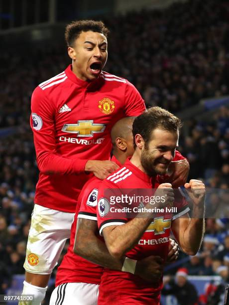 Juan Mata of Manchester United celebrates scoring his team's second goal with Jesse Lingard during the Premier League match between Leicester City...