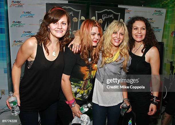 Brett Anderson, Maya Ford, Allison Robertson and Amy Cesari of The Donnas pose for pictures at the NBC Experience Store as part of the Gibson...