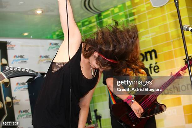 Brett Anderson and Maya Ford of The Donnas pay tribute to Les Paul at the NBC Experience Store as part of the Gibson Sessions on August 13, 2009 in...