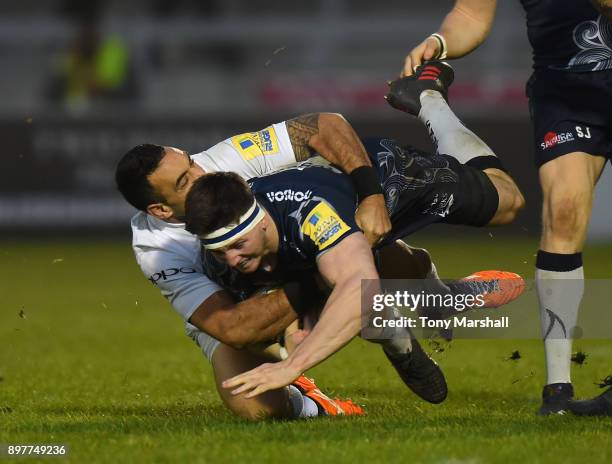 Ben Curry of Sale Sharks is tackled by Kahn Fotualii of Bath Rugby during the Aviva Premiership match between Sale Sharks and Bath Rugby at AJ Bell...