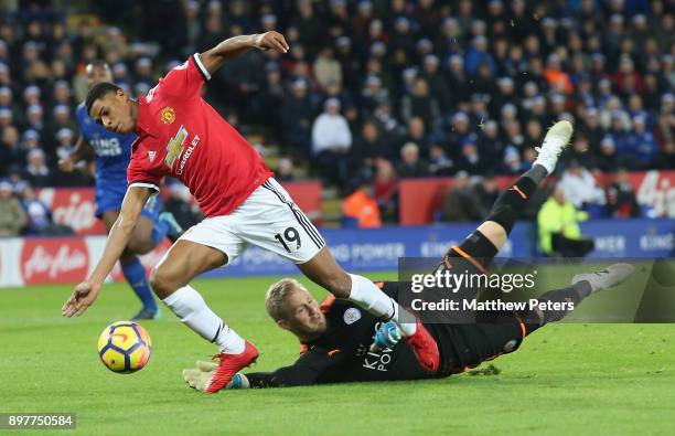 Marcus Rashford of Manchester United is brought down by Kasper Schmeichel of Leicester City but no penalty is given during the Premier League match...