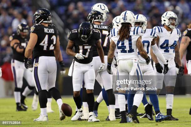 Wide Receiver Mike Wallace of the Baltimore Ravens celebrates after a play in the first quarter against the Indianapolis Colts at M&T Bank Stadium on...