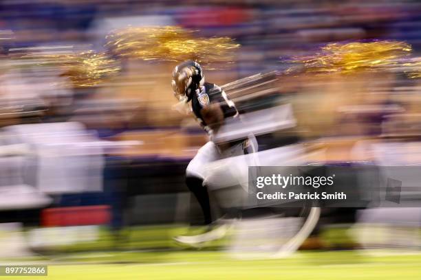 Outside Linebacker Terrell Suggs of the Baltimore Ravens runs onto the field prior to the game against the Indianapolis Colts at M&T Bank Stadium on...