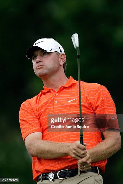 Lucas Glover watches his tee shot on the eighth hole during the first round of the 91st PGA Championship at Hazeltine National Golf Club on August...