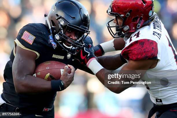 Ahmad Bradshaw of the Army Black Knights carries the ball against Tariq Thompson of the San Diego State Aztecs in the first half on December 23, 2017...