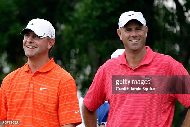 Lucas Glover and Stewart Cink wait on the seventh tee during the first round of the 91st PGA Championship at Hazeltine National Golf Club on August...