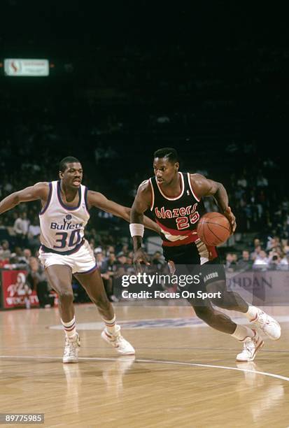 S: Jerome Kersey of the Portland Trailblazers in action drives pass Bernard King of the Washington Bullets during a late circa 1980's NBA basketball...