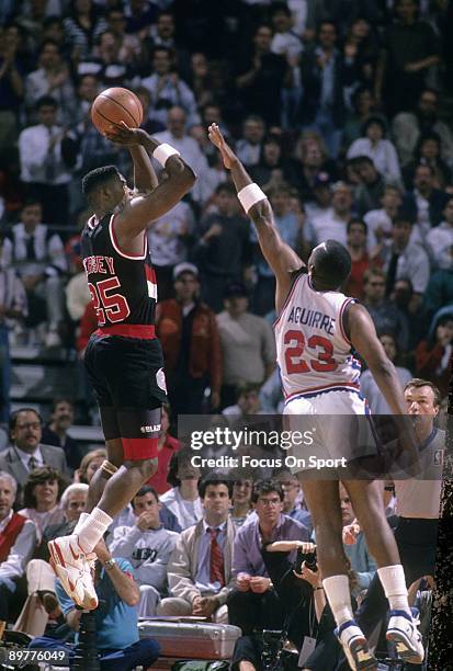 S: Jerome Kersey of the Portland Trailblazers in action shooting over Mark Aguirre during a late circa 1980's NBA basketball game at the the Palace...