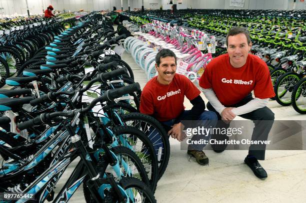 Dan Alion, left, wheel coordinator, and Will Beard, director of The Spokes Group, helped gather and organize thousands of bicycles donated by the...