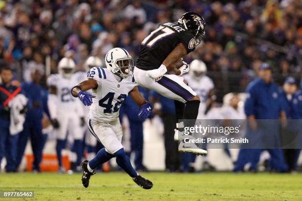 Wide Receiver Mike Wallace of the Baltimore Ravens catches the ball in the second quarter against the Indianapolis Colts at M&T Bank Stadium on...