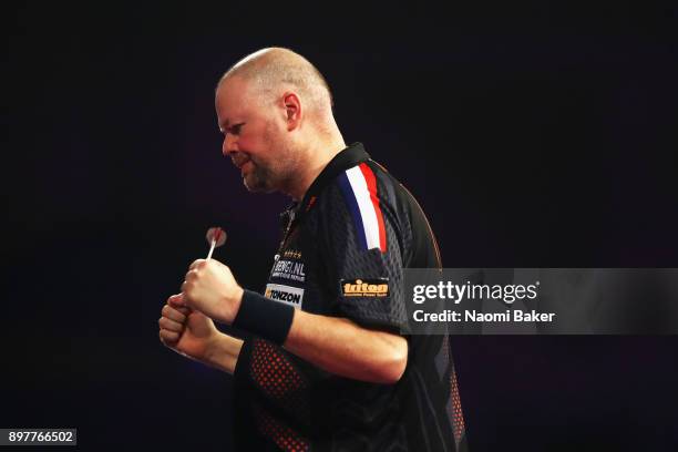 Raymond van Barneveld of the Netherlands celerates after winning the second round match against Kyle Anderson of Austria on day ten of the 2018...