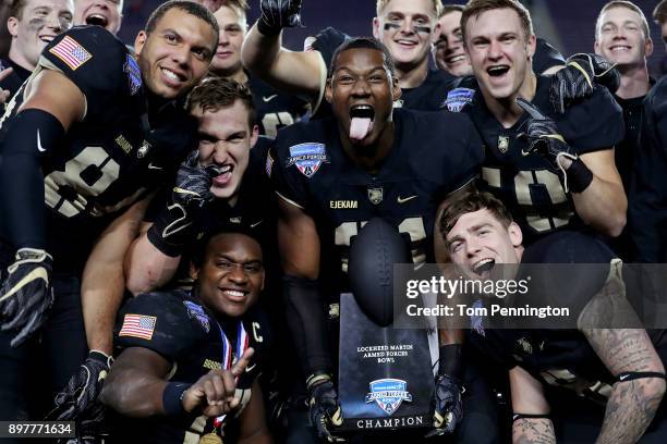 Members of the Army Black Knights including Ahmad Bradshaw of the Army Black Knights and Jeff Ejekam of the Army Black Knights celebrate with the...