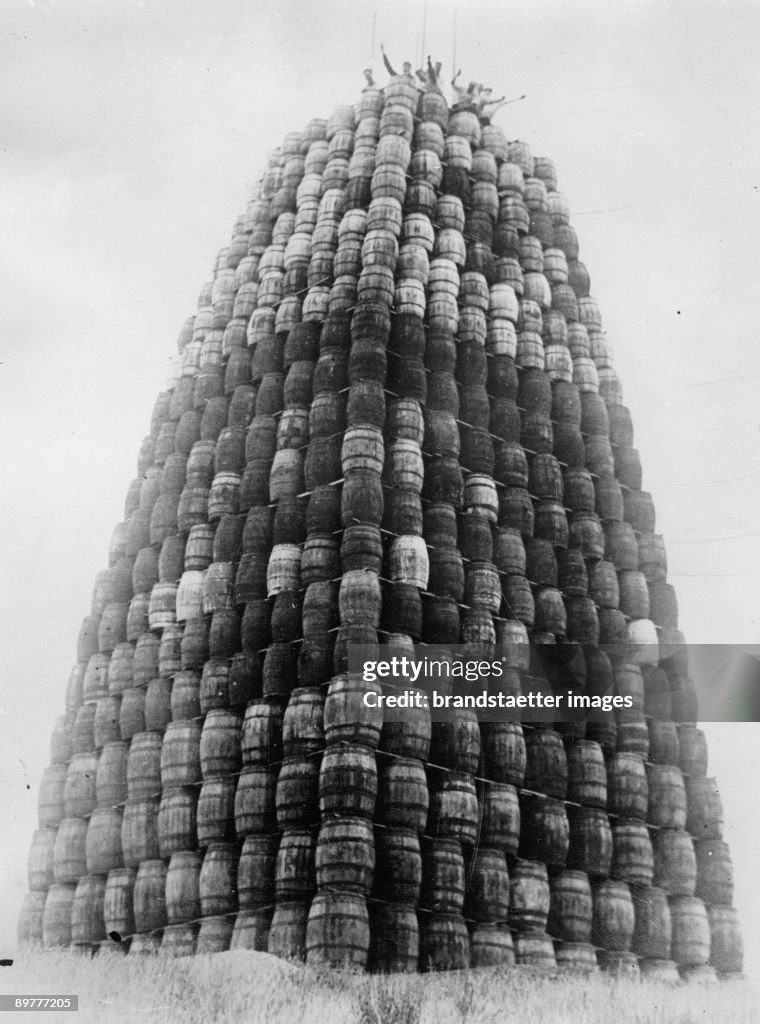 Prohibition: A tower built with barrels of alcohol, which should be destroyed later. Photograph. 1929.