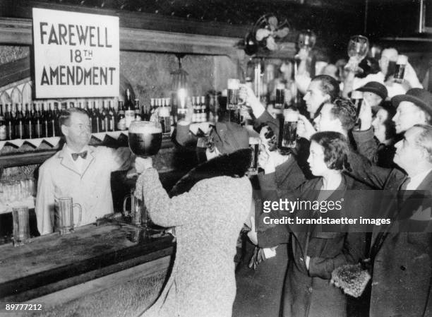 People of New York are celebrating the end of the Prohibition with beer. Photograpg. 1933.