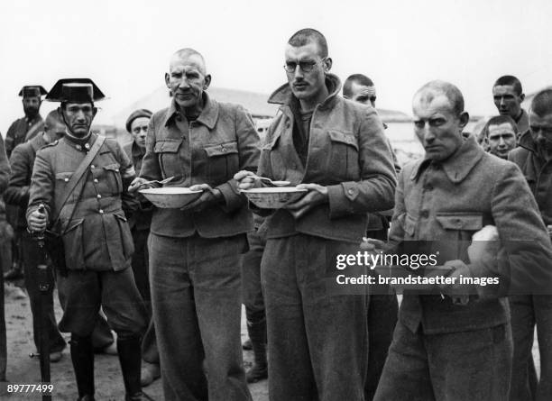 Three from 25 English prisoners of war, who hat fought on the side of the Spanish government against the Nationalists led by General Franco in the...
