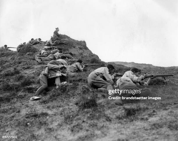 In the great battle for San Sebastian, rebel soldiers take positon on the ridge of the Somosierra Mountainds, overlooking San Sebastian. Madrid....