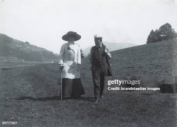 The Austrian composer Gustav Mahler and his wife Alma taking a walk nearby their summer residence in Toblach . Photograph. 1909.