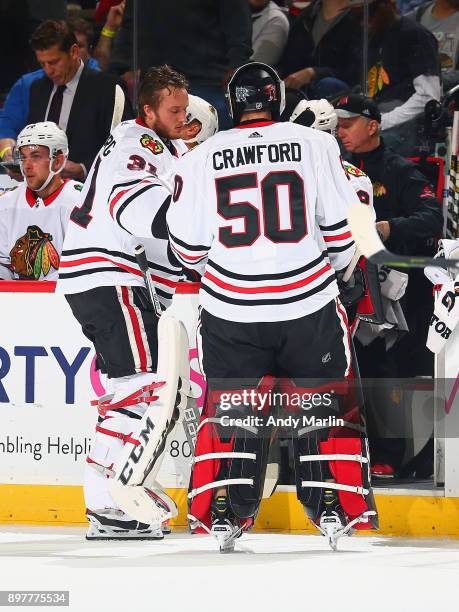 Corey Crawford of the Chicago Blackhawks is replaced by Anton Forsberg after giving up three goals on seven shots in the first period against the New...