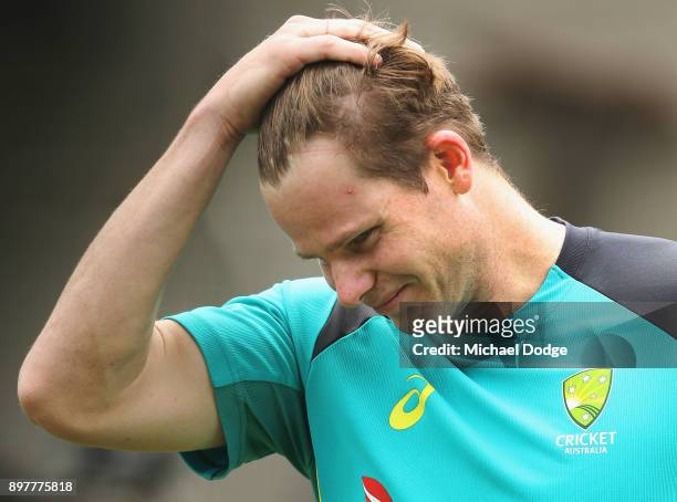 Steve Smith of Australia looks in discomfort after copping a freakish knock to his wrist while sitting in the nets after Cameron Bancroft the ball...