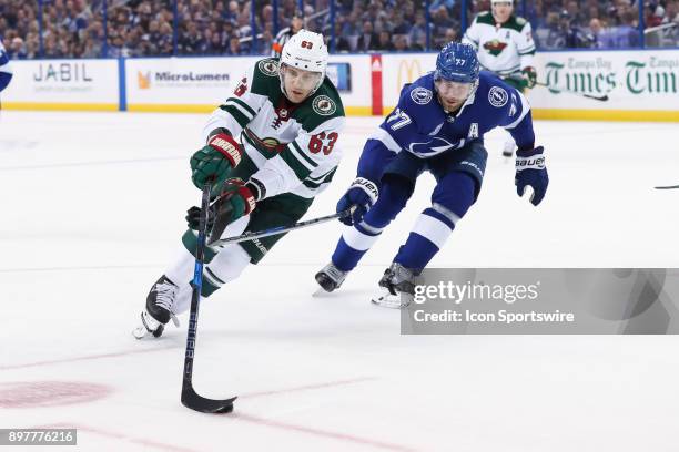 Minnesota Wild left wing Tyler Ennis is defended by Tampa Bay Lightning defenseman Victor Hedman in the first period of the NHL game between the...