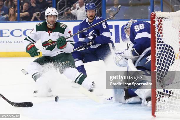 Minnesota Wild center Matt Cullen tries to get the rebound after Tampa Bay Lightning goalie Andrei Vasilevskiy blocked his shot in the first period...