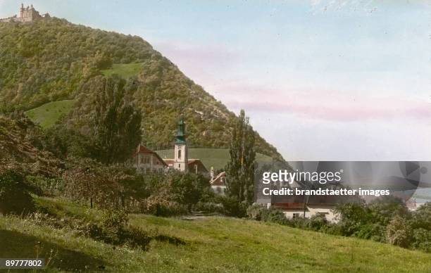 The Kahlenbergerdorf in Vienna, in the top left-hand corner of the photograph the curch on the Leopoldsberg. Vienna, 19th district. Hand-colored...